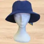Wide brim navy blue sun hat on model