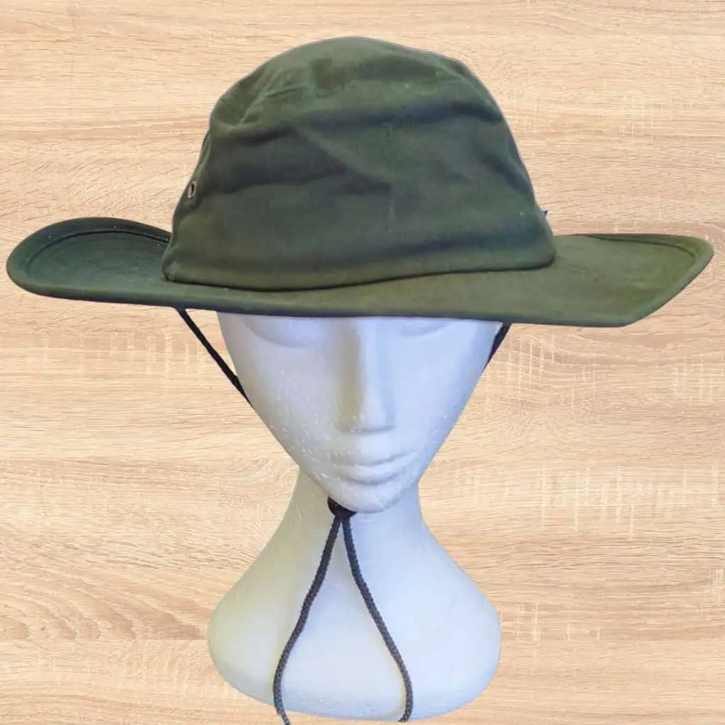 Wide brim green hat on model