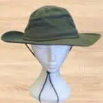 Wide brim green hat on model