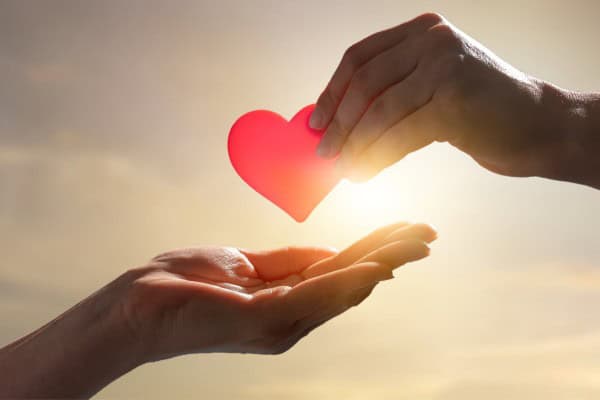 Hands holding a heart